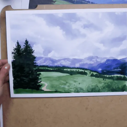 Работа над акварельным пейзажем с горами и лесом в арт-студии
